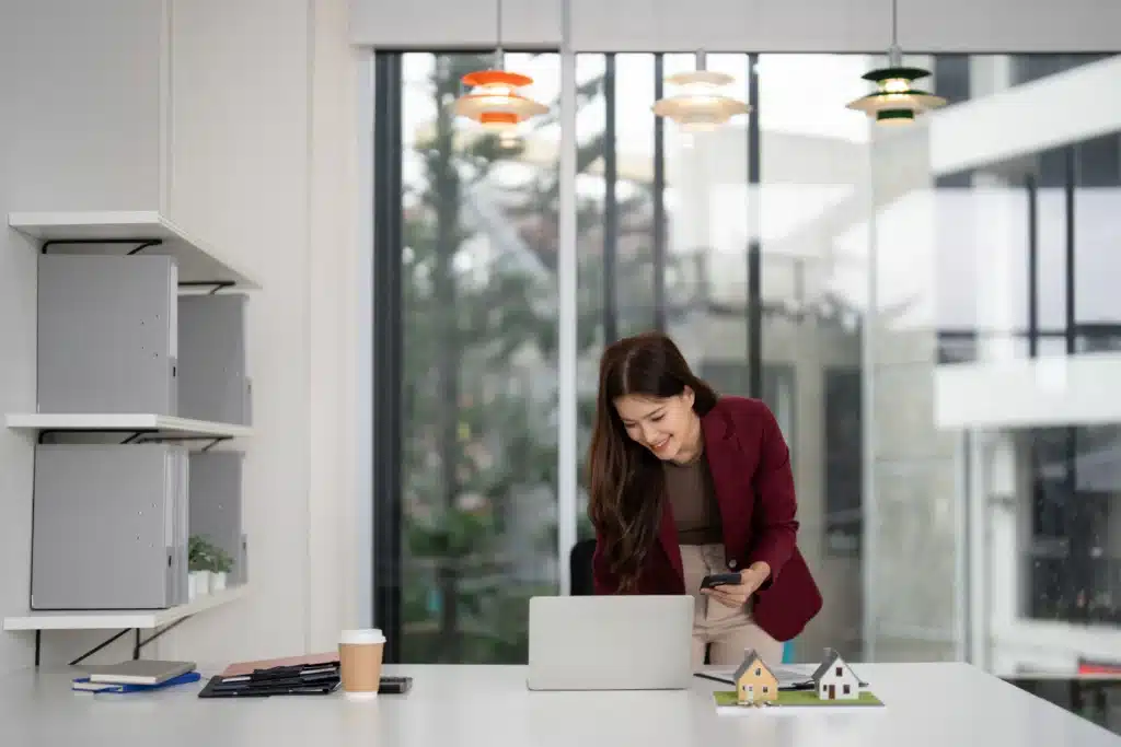 Best accounting software for property management shown by landlord reviewing portfolio data on laptop in modern office.