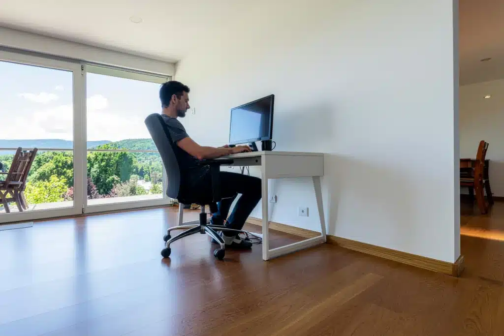 Best accounting software for landlords shown as a professional working on a desktop computer in a bright home office.