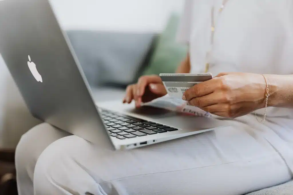 tenant making rent collection payment online using credit card on laptop at home